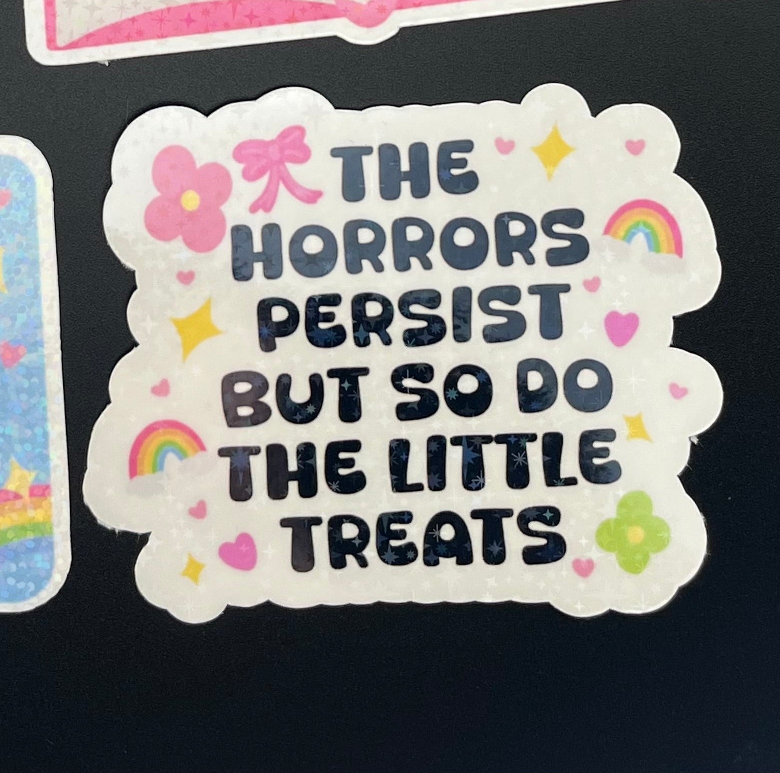 The Horrors Persist But So Do The Little Treats Sticker
